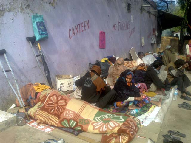 Patients on a pavement outside AIIMS canteen.